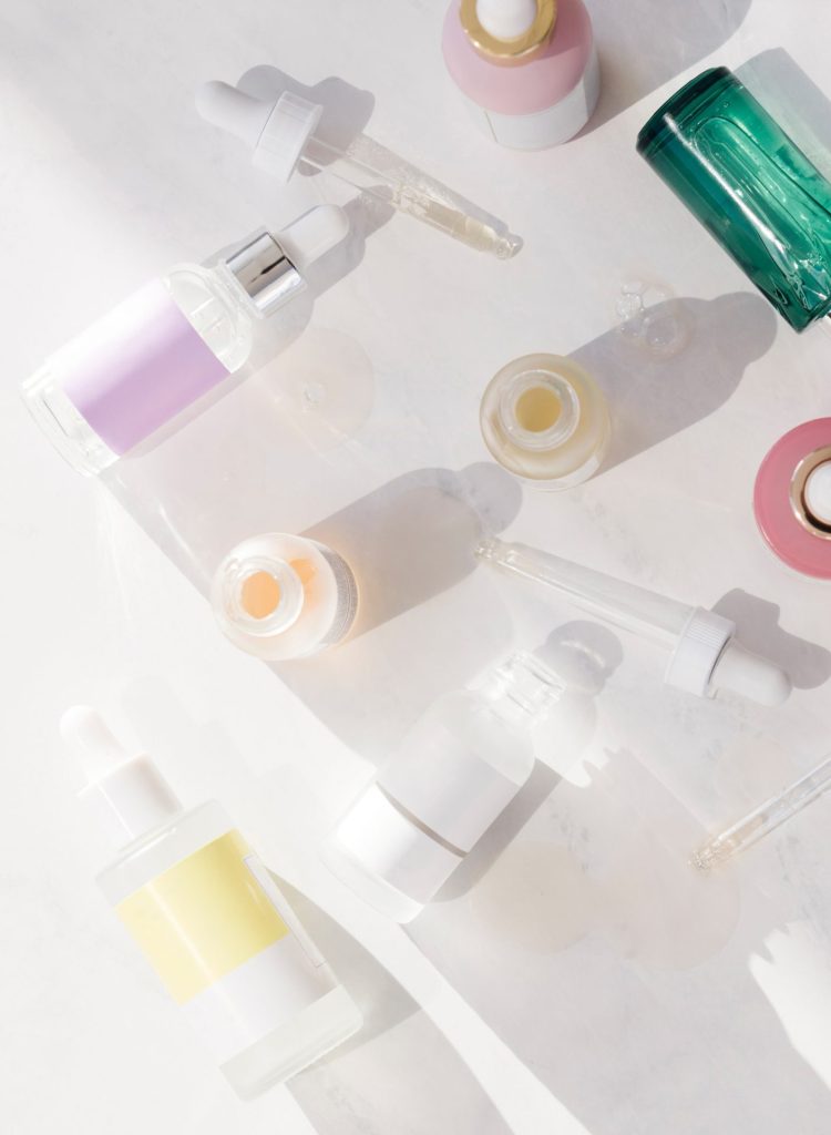 flay lay of bottles in skincare and cosmetics